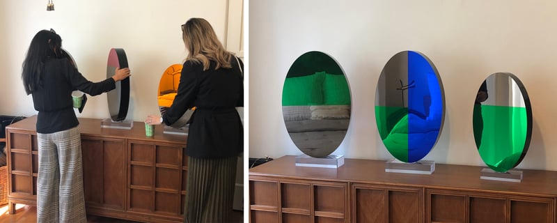 A side by side view of 3 of Shana’s sculptures, which swivel on an acrylic base and reflect light in the space. 
